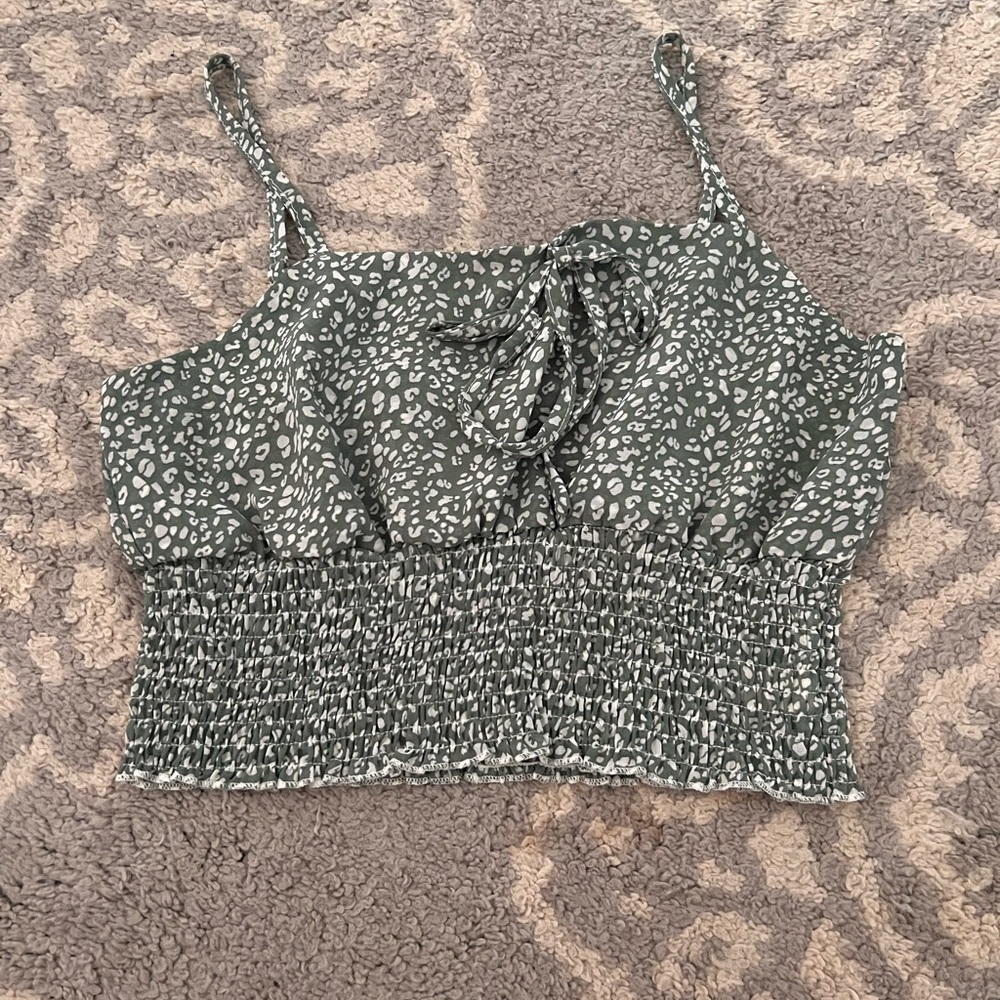 Green top with adjustable straps and bow in front. Size small. Brand Romwe.
